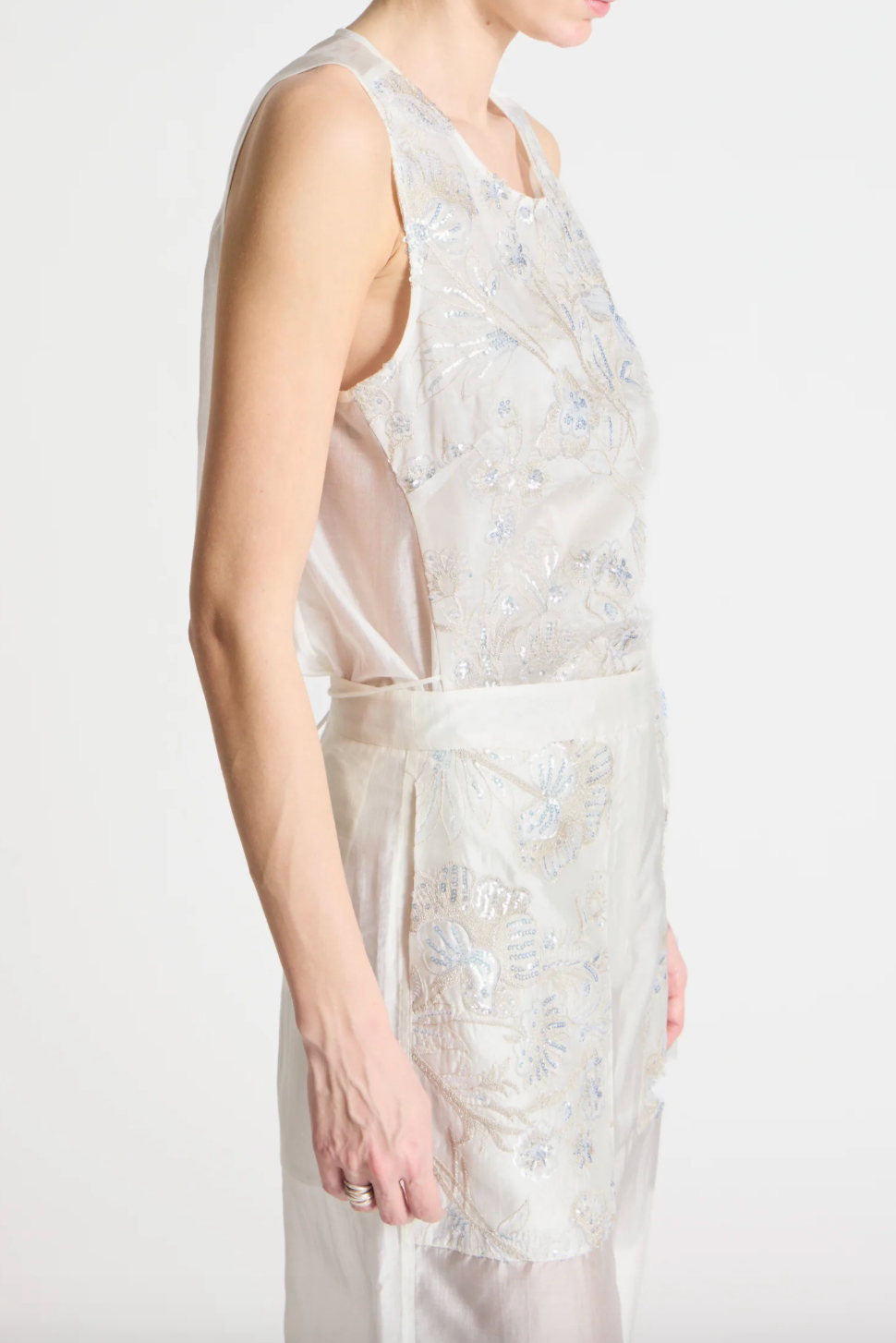 person wearing person wearing saint art womens Benson Floral Sequin Blouse and Sequin Hewes Pants in Ivory