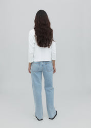 person wearing still here new york womens Everyday Jean in Vintage Blue
