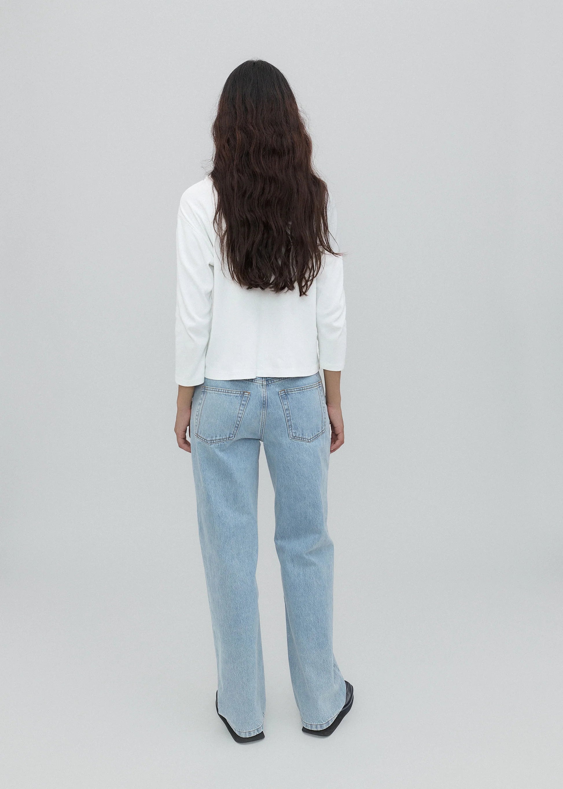 person wearing still here new york womens Everyday Jean in Vintage Blue