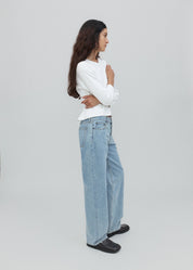 person wearing still here new york womens Everyday Jean in Vintage Blue