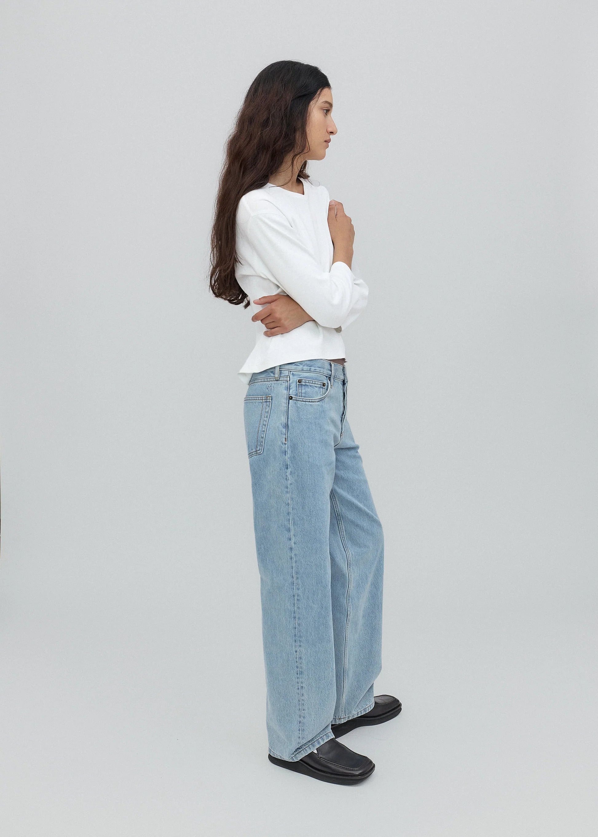 person wearing still here new york womens Everyday Jean in Vintage Blue