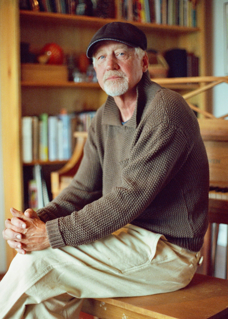 person wearing wythe mens Moss Stitch Collared Sweater in Dusty Olive