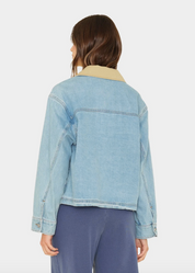 person wearing xirena womens Cove Denim Jacket in Blue Cloud